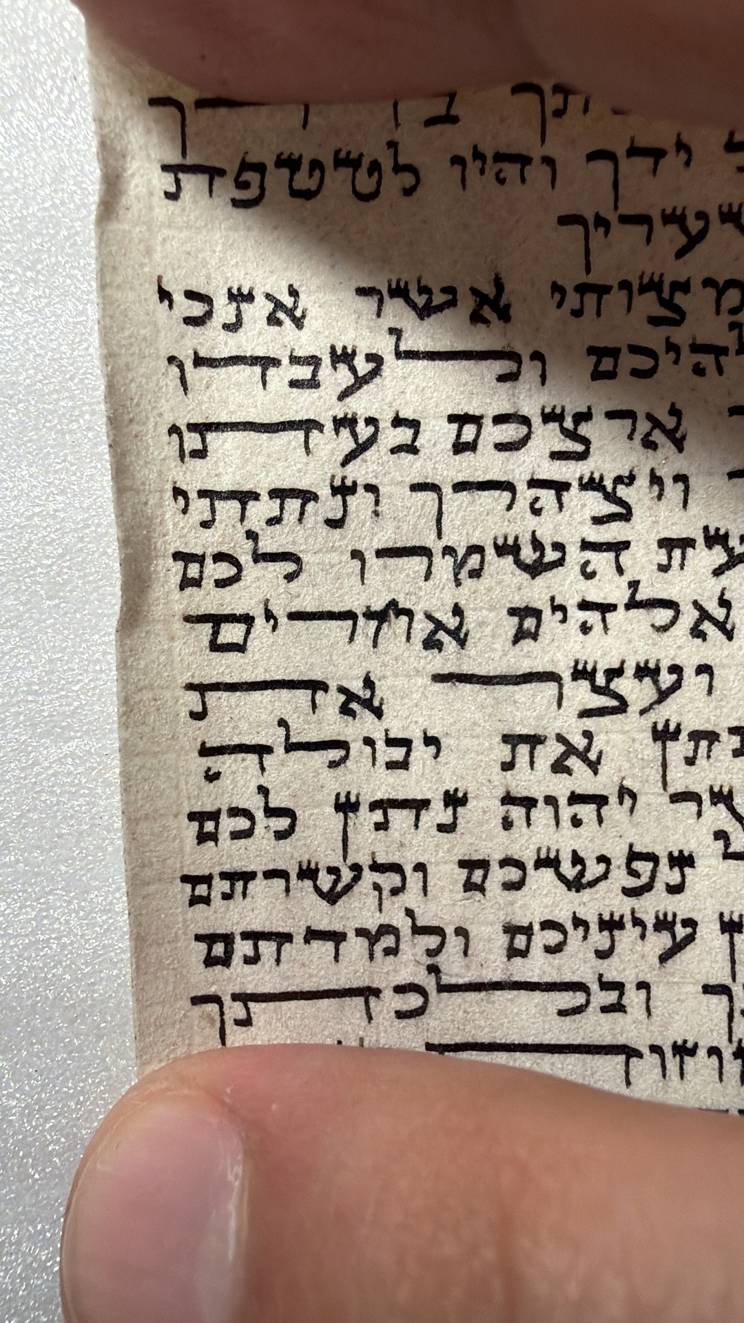 Real mezuzah scroll photographed during a professional mezuzah checking in Miami